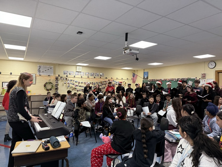 EMHS Chamber choir sings for 6th grade chorus 