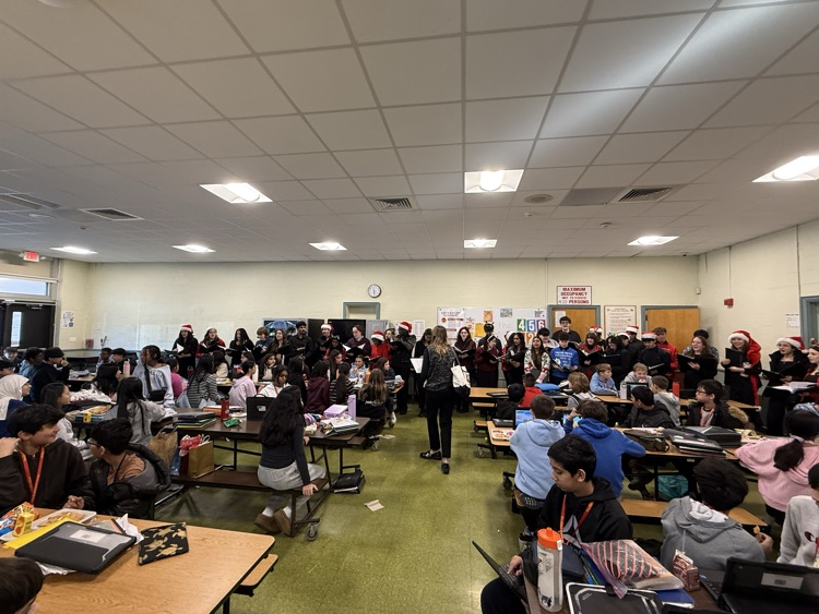 EMHS Chamber choir sings in the cafeteria 