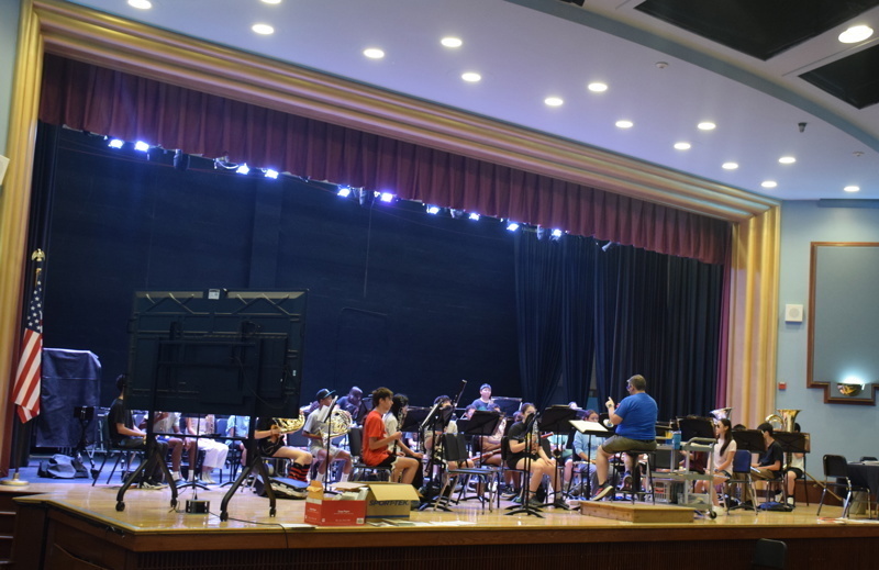 band rehearsal on stage with conductor