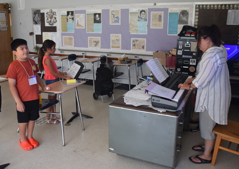 children in classroom music lesson