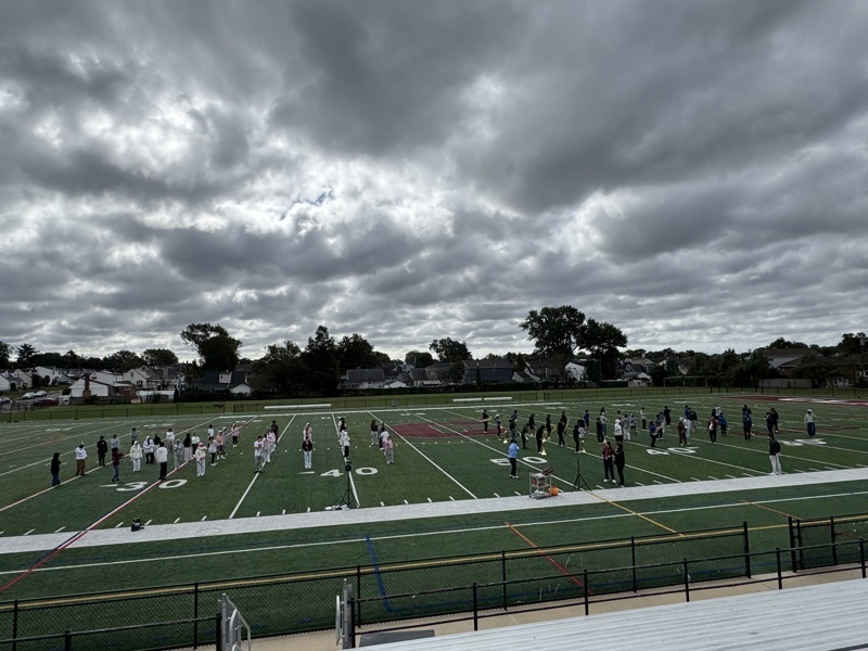 People practicing on football field