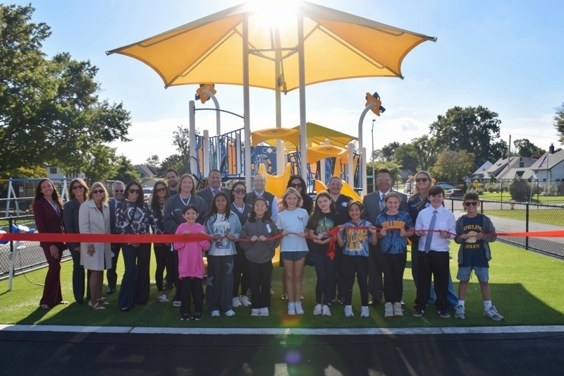 Playground ribbon cutting ceremony group photo