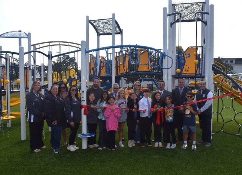 Playground ribbon cutting ceremony group photo