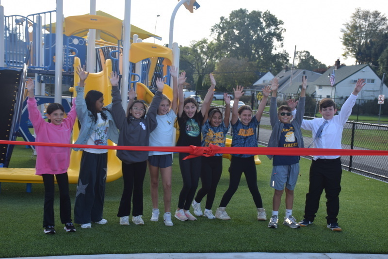 Playground ribbon cutting ceremony group photo