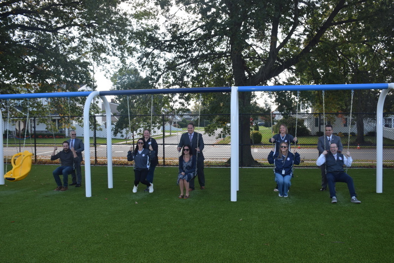 Playground ribbon cutting ceremony group photo