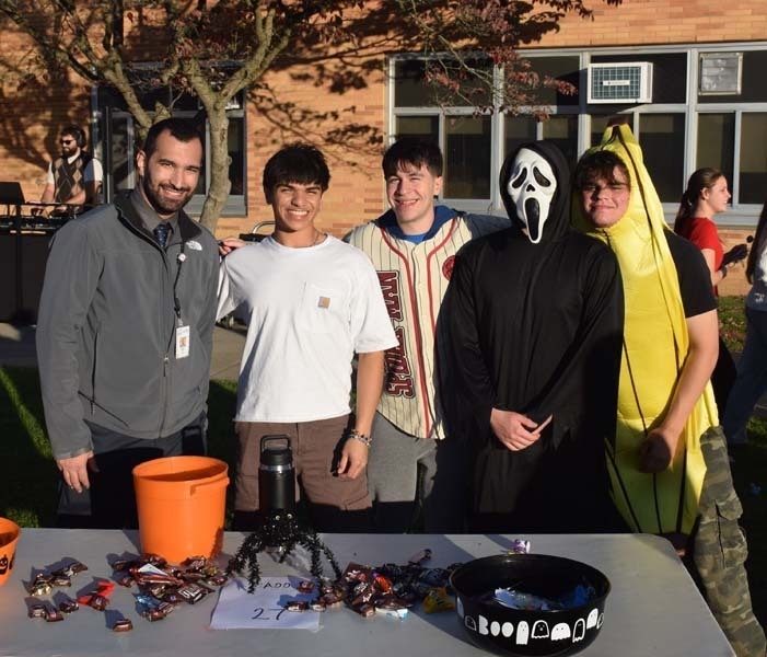 Students smiling together outside.