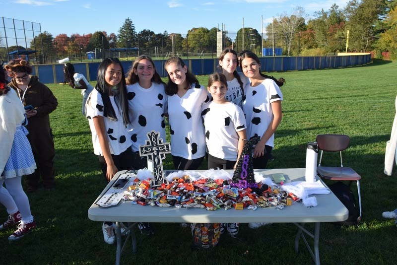 Students at a table full of candy