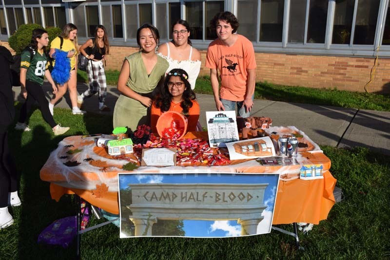 Students at a table full of candy