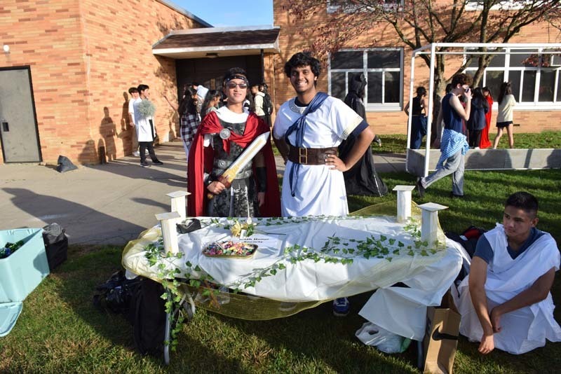 Students at a table full of candy