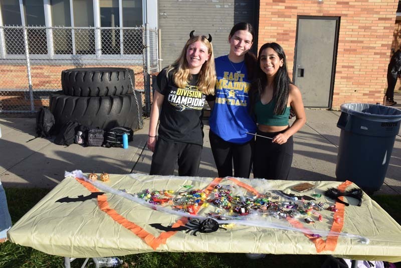 Students at a table full of candy