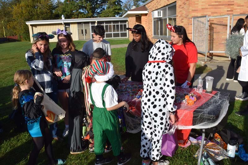 Costumed students getting candy