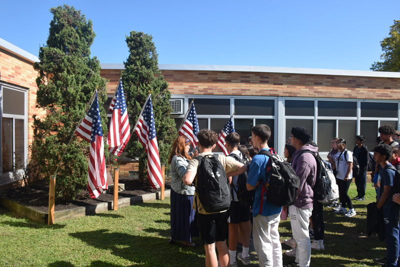 people outdoors by flags