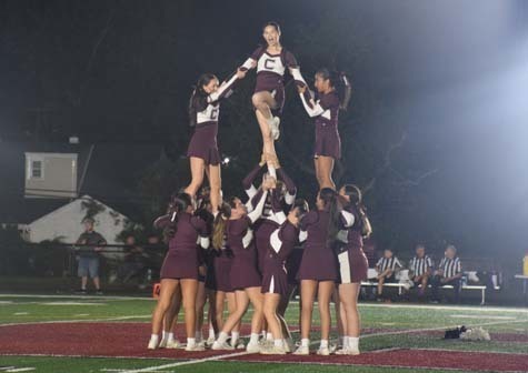 The Rams varsity cheerleaders entertained the crowd throughout the homecoming game.    