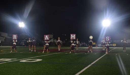 The Rams varsity cheerleaders entertained the crowd throughout the homecoming game.    
