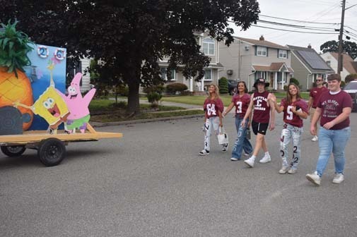 The Rams marching band and flag corps paraded down Washington Avenue. 