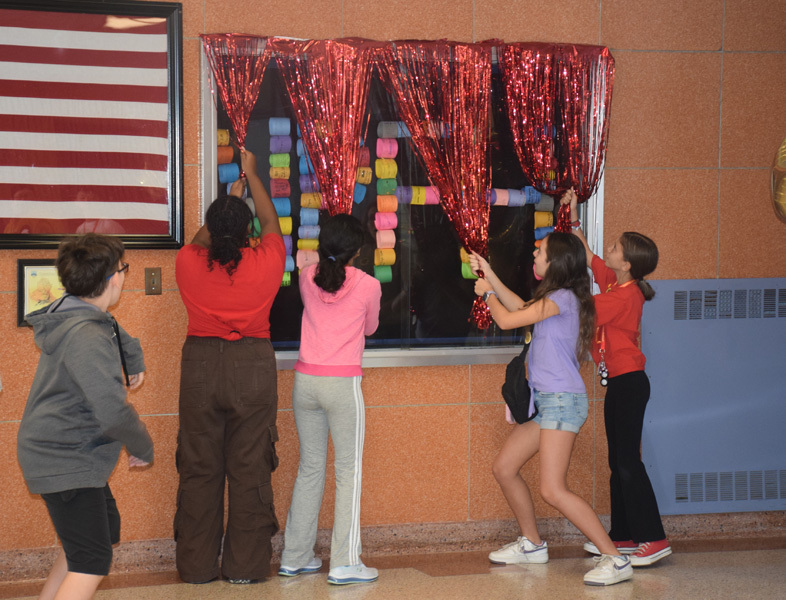 3: Students unveiled their new pledge display in the school’s main lobby. 