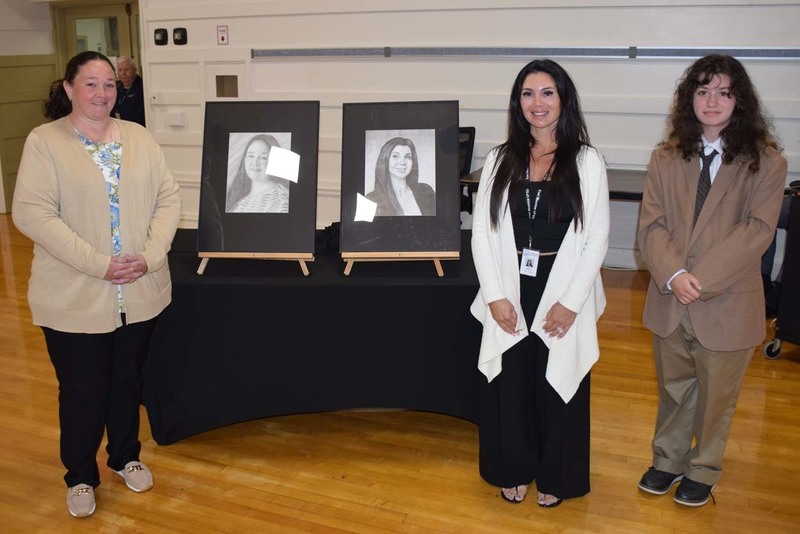 Siobhan Licastro, left, was honored with an official portrait from East Meadow High School senior Maleeha Fatima. 