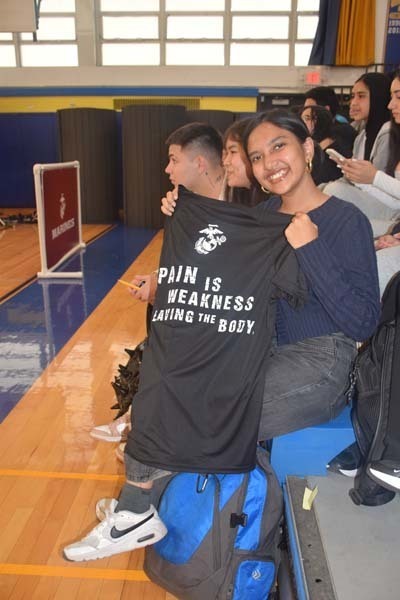 5: Students also received free T-shirts from members of the No Hate Tour. 