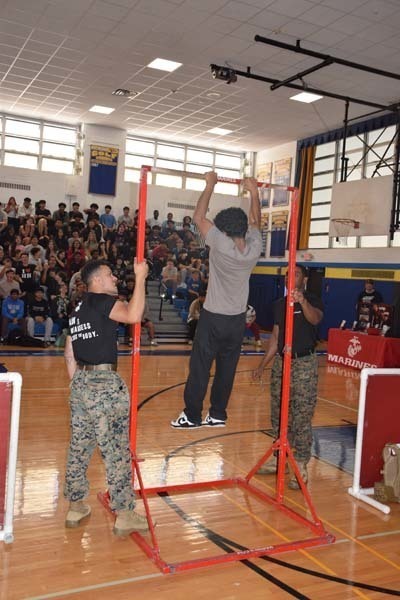 6: Members of the U.S. Marine Corps held a pull up challenge to promote physical health and wellness. 