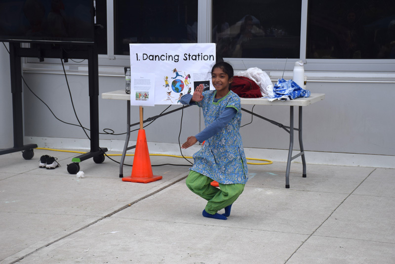 person dressed in cultural clothing doing a demonstration