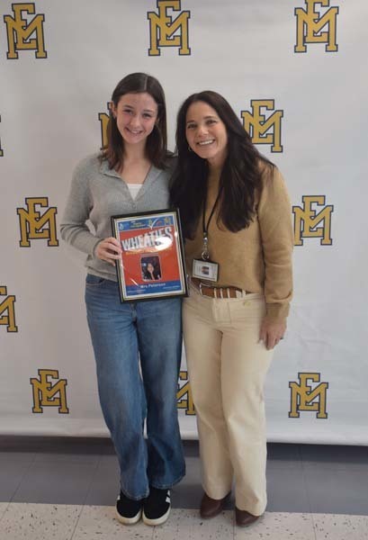 Photo of student and faculty member holding Breakfast of Champions plaque.
