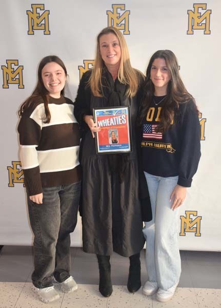 Photo of student and faculty member holding Breakfast of Champions plaque.