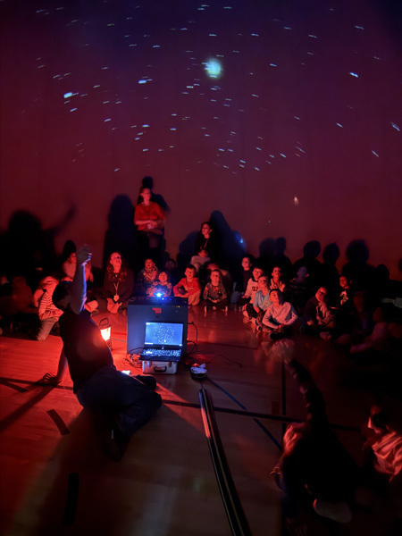 students in planetarium