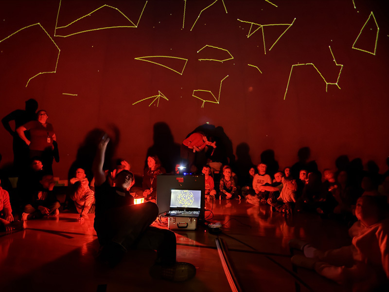 students in planetarium