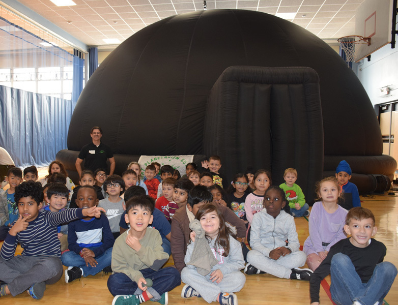 students in planetarium