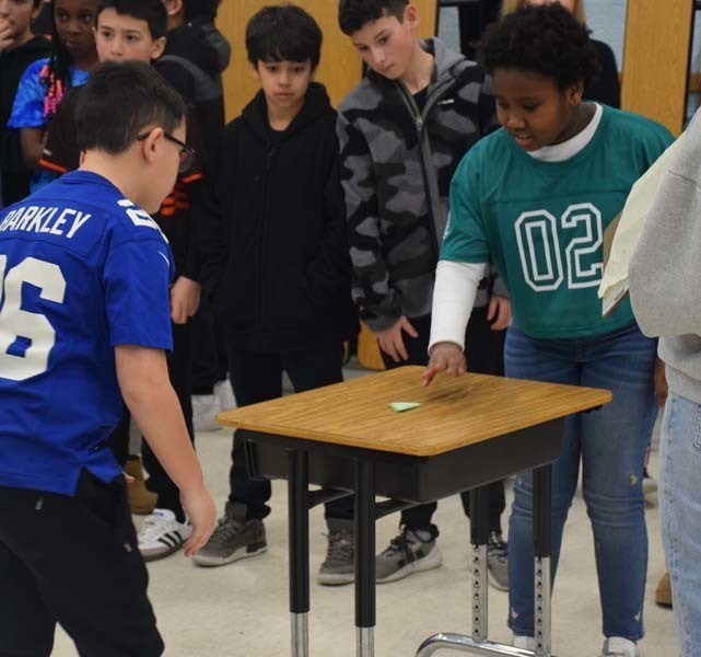 P Students cheered on their peers with signs and posters. 