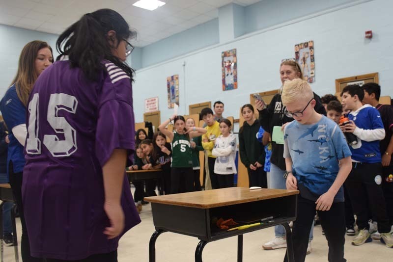P Students cheered on their peers with signs and posters. 
