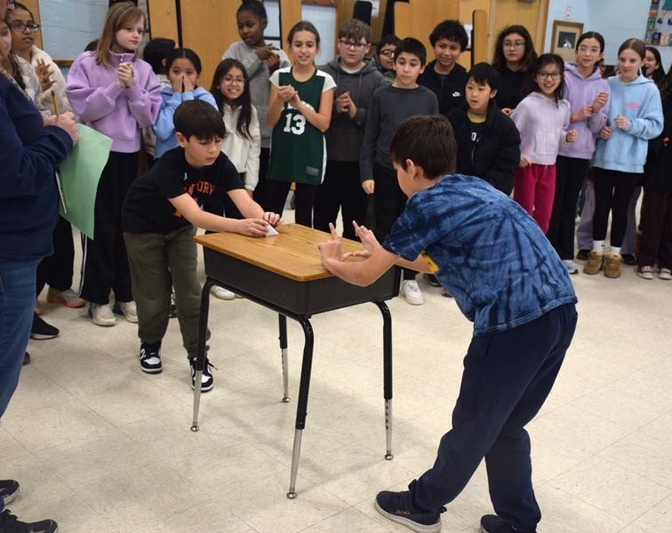 P Students cheered on their peers with signs and posters. 