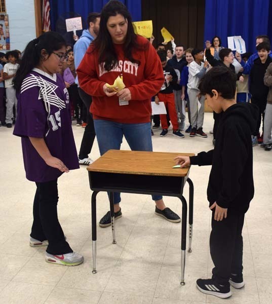 P Students cheered on their peers with signs and posters. 