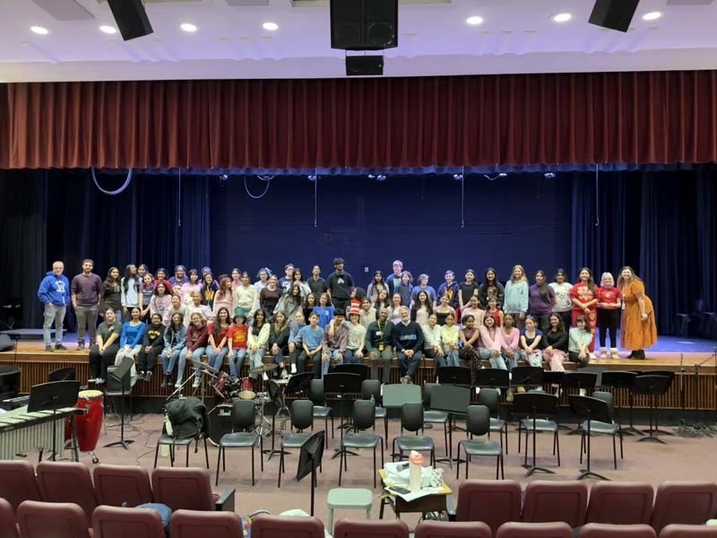 Students performing on stage.