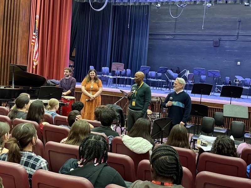 Students performing on stage.