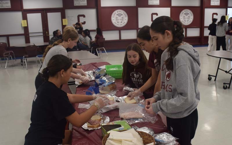 Students at W.T. Clarke Middle School in East Meadow partnered with Rock CAN Roll, Inc. to pack 750 lunches for individuals and families in need. 