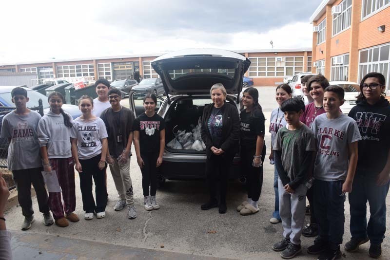 Students at W.T. Clarke Middle School in East Meadow partnered with Rock CAN Roll, Inc. to pack 750 lunches for individuals and families in need. 