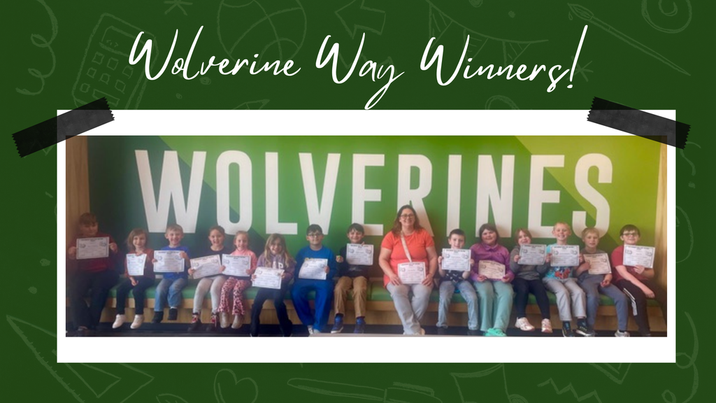 Elementary students proudly displaying their Wolverine Way certificates