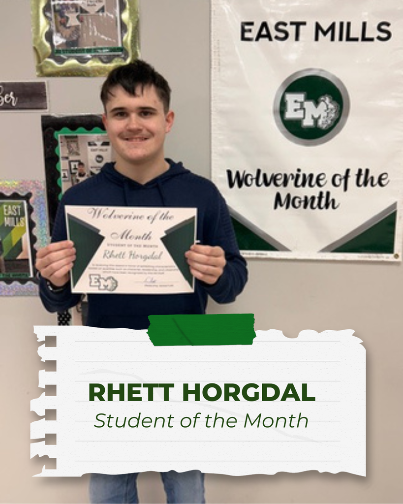 Rhett Horgdal, Student of the Month, standing and smiling while holding his certificate