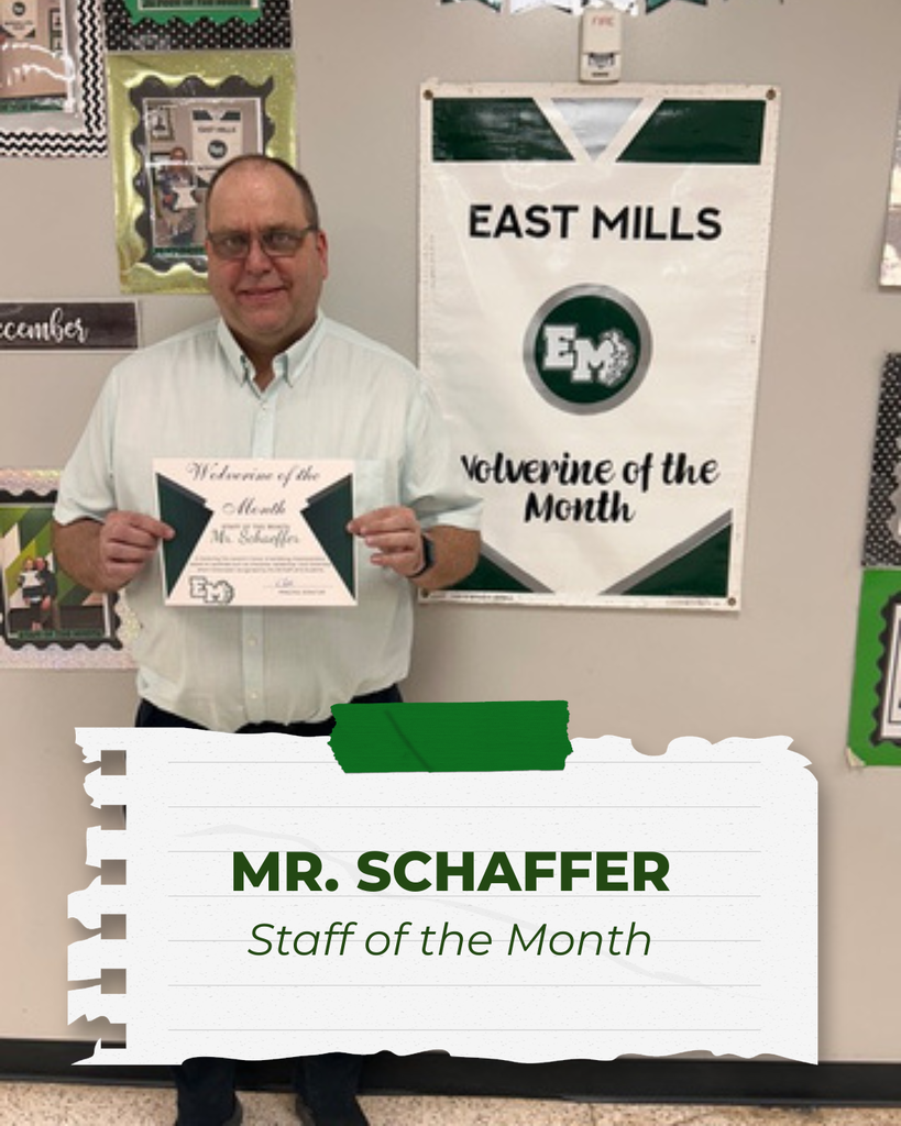 Mr. Schaffer, Staff of the Month, standing and smiling while holding his certificate