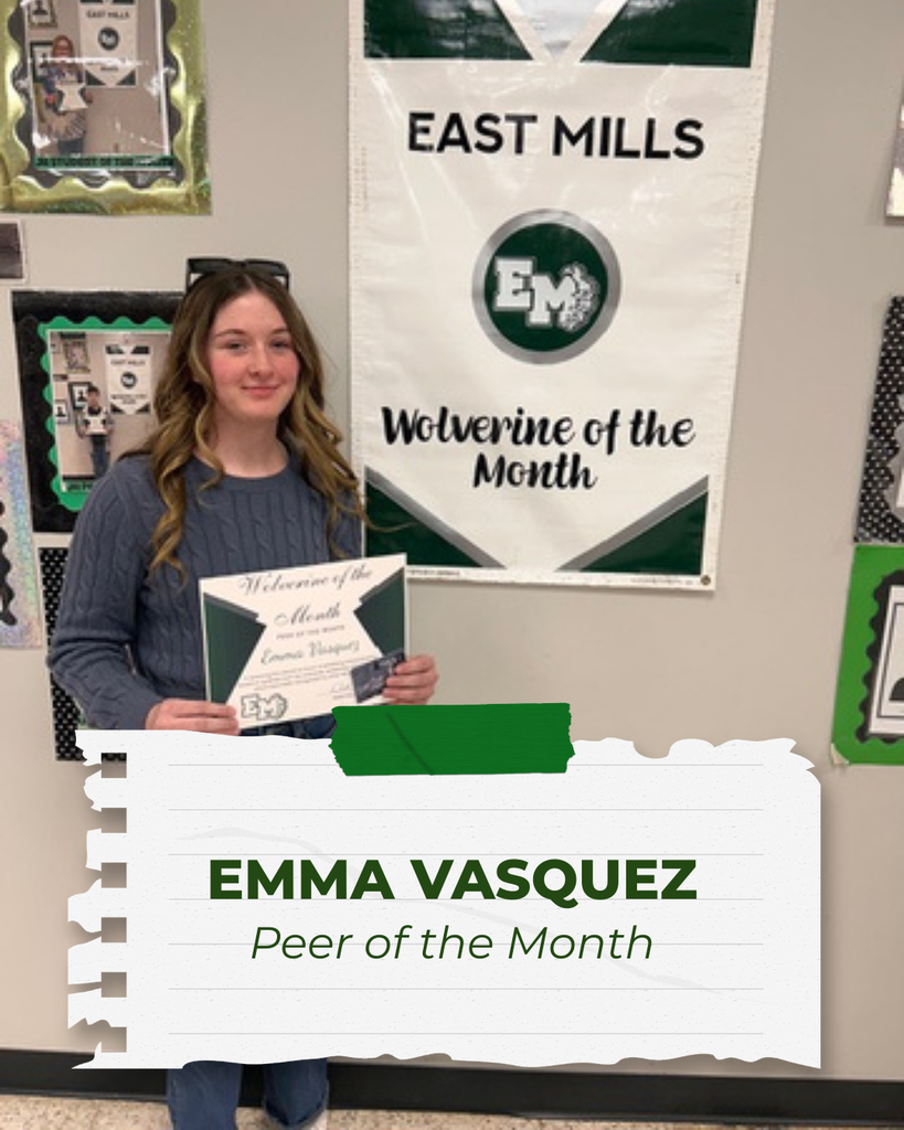 Emma Vasquez, Peer of the Month, standing and smiling while holding her certificate