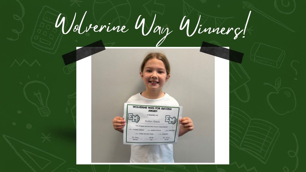 A young girl smiles while holding up a certificate.