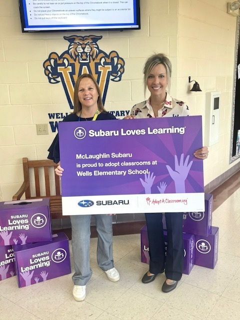 photo of staff holding sign
