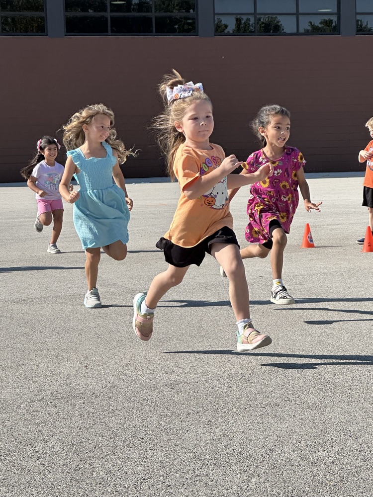 photo of students running/playing