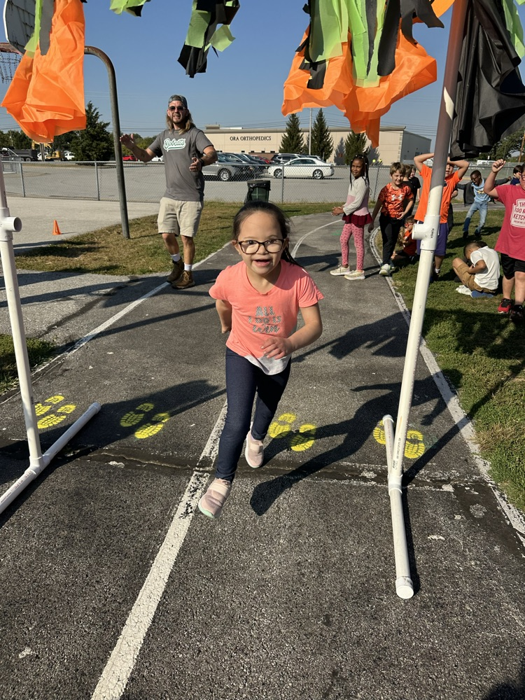 photo of students running/playing