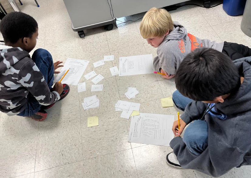 Students working on the floor