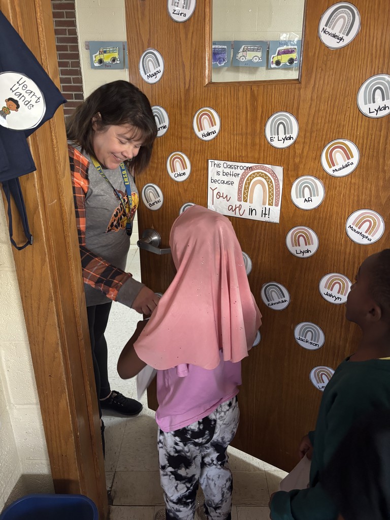 Kindergarten and first grade students decorate Halloween treat bags and practice trick-or-treating during a social lesson led by Speech-Language Pathologists.