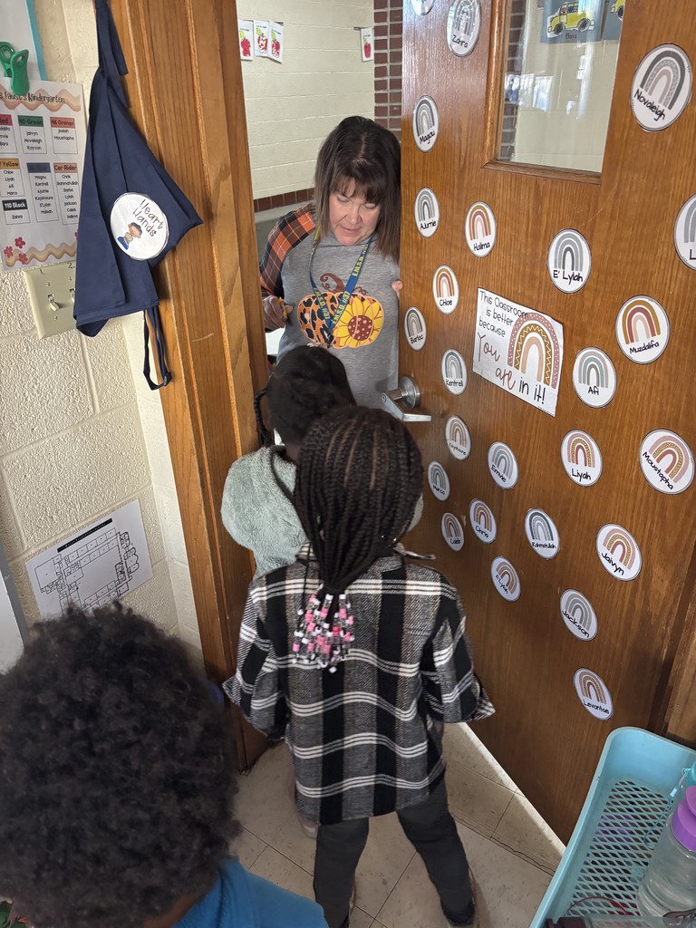 Kindergarten and first grade students decorate Halloween treat bags and practice trick-or-treating during a social lesson led by Speech-Language Pathologists.