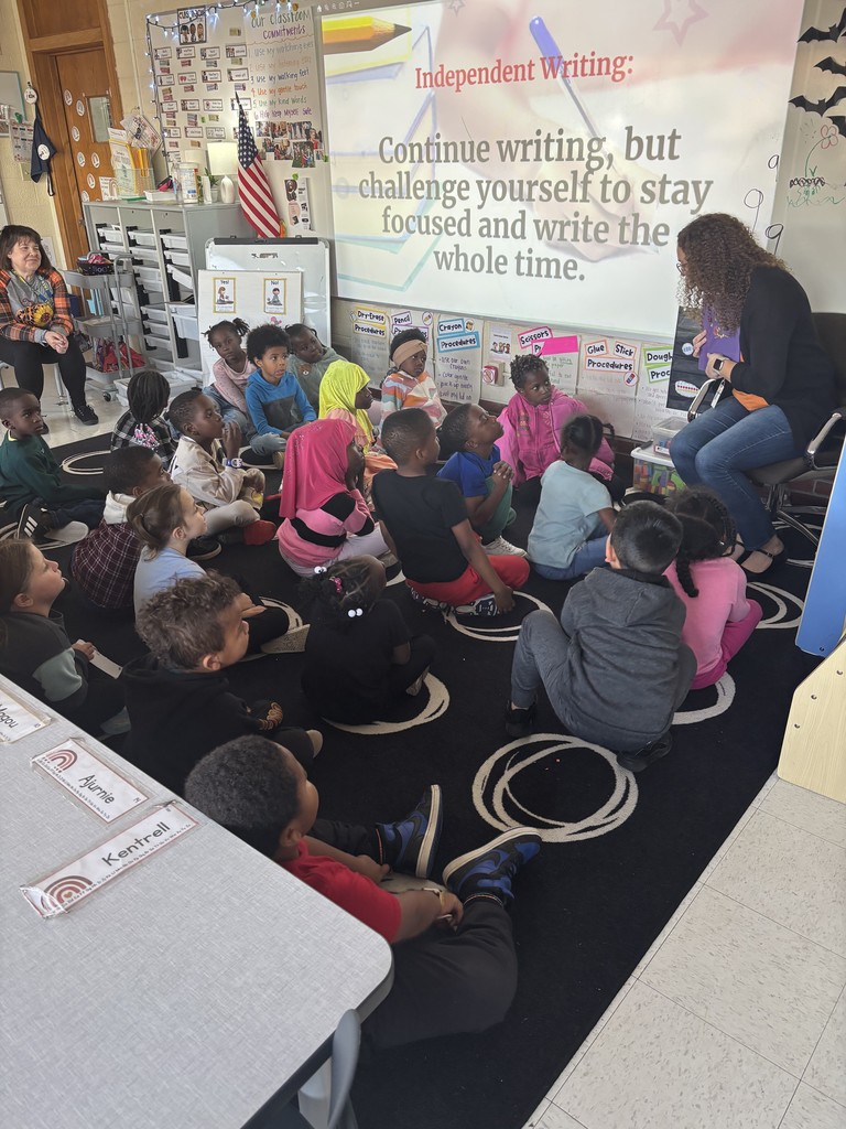 Kindergarten and first grade students decorate Halloween treat bags and practice trick-or-treating during a social lesson led by Speech-Language Pathologists.