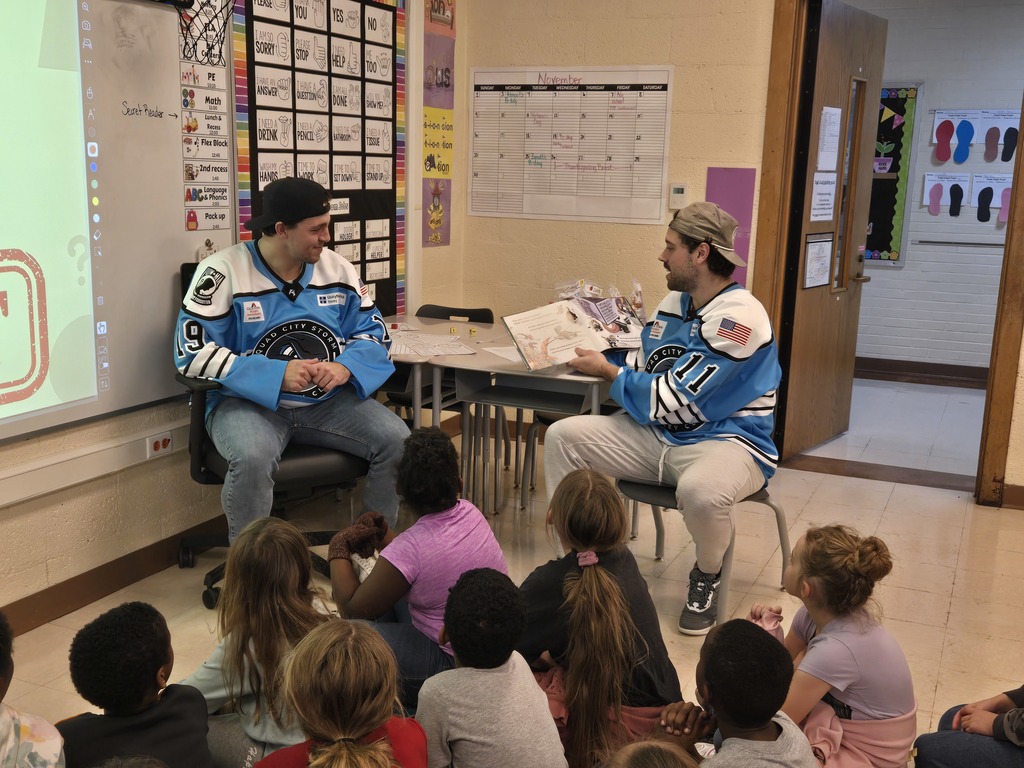 Players reading to students